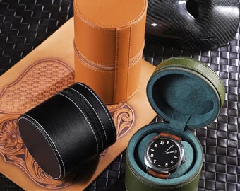 May include: Three round leather watch boxes in different colors. The boxes are lined with soft fabric and have a zipper closure. The boxes are perfect for storing and protecting your valuable watches.
