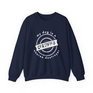 May include: Navy blue sweatshirt with a white graphic that says "my dog is a certified course destroyer" in a vintage style font.