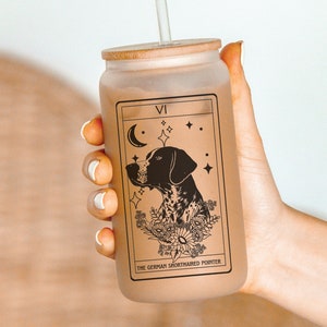 May include: A frosted glass tumbler with a bamboo lid and a straw. The tumbler features a black and white illustration of a German Shorthaired Pointer dog with the text "VI THE GERMAN SHORTHAIRED POINTER".