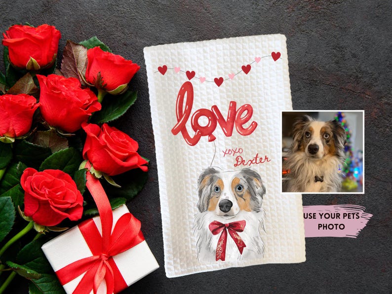 May include: White waffle-weave towel with a watercolor illustration of a dog wearing a red bow tie. The word "Love" is written in red balloon letters, with "xoxo Dexter" below. A photo of the dog is in the corner. Red roses and a gift box are nearby.