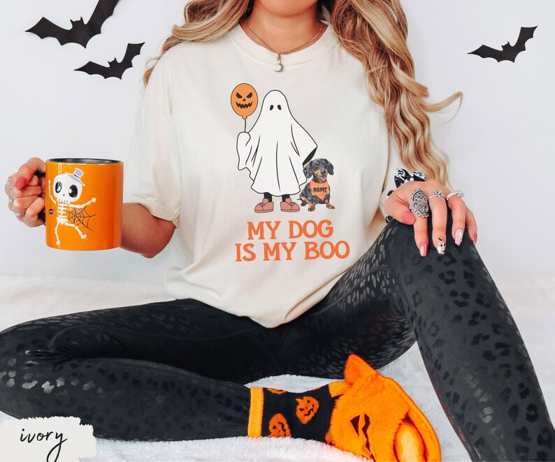 a woman sitting on a bed holding a coffee mug
