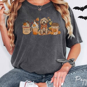 a woman wearing a t - shirt with a dog on it