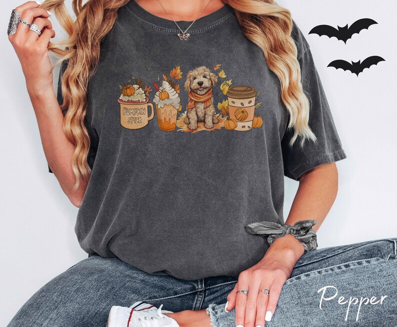 a woman wearing a t - shirt with a dog on it