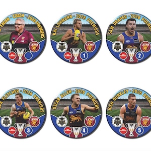 May include: A set of six circular commemorative badges featuring Australian Football League figures. Each badge displays a player or coach, the text 2026 PREMIERS, a trophy icon, a team logo, and a numbered circle. The designs include Chris Fagan, Kai Lohmann, Sam Draper, Jaspa Fletcher, Oscar Allen, and Josh Dunkley.