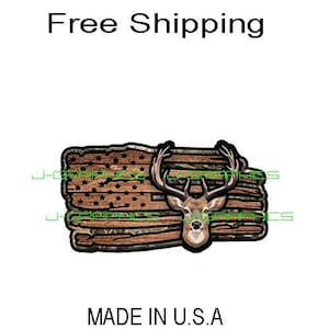 May include: A sticker featuring a deer head superimposed over a distressed American flag design. The flag has brown and camouflage elements with stars. The text "MADE IN U.S.A" is at the bottom.