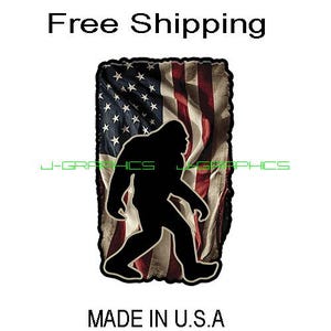 May include: A black silhouette of Bigfoot walking in front of an American flag. The flag is red, white, and blue with a distressed look. The text "Made in U.S.A." is below the image.