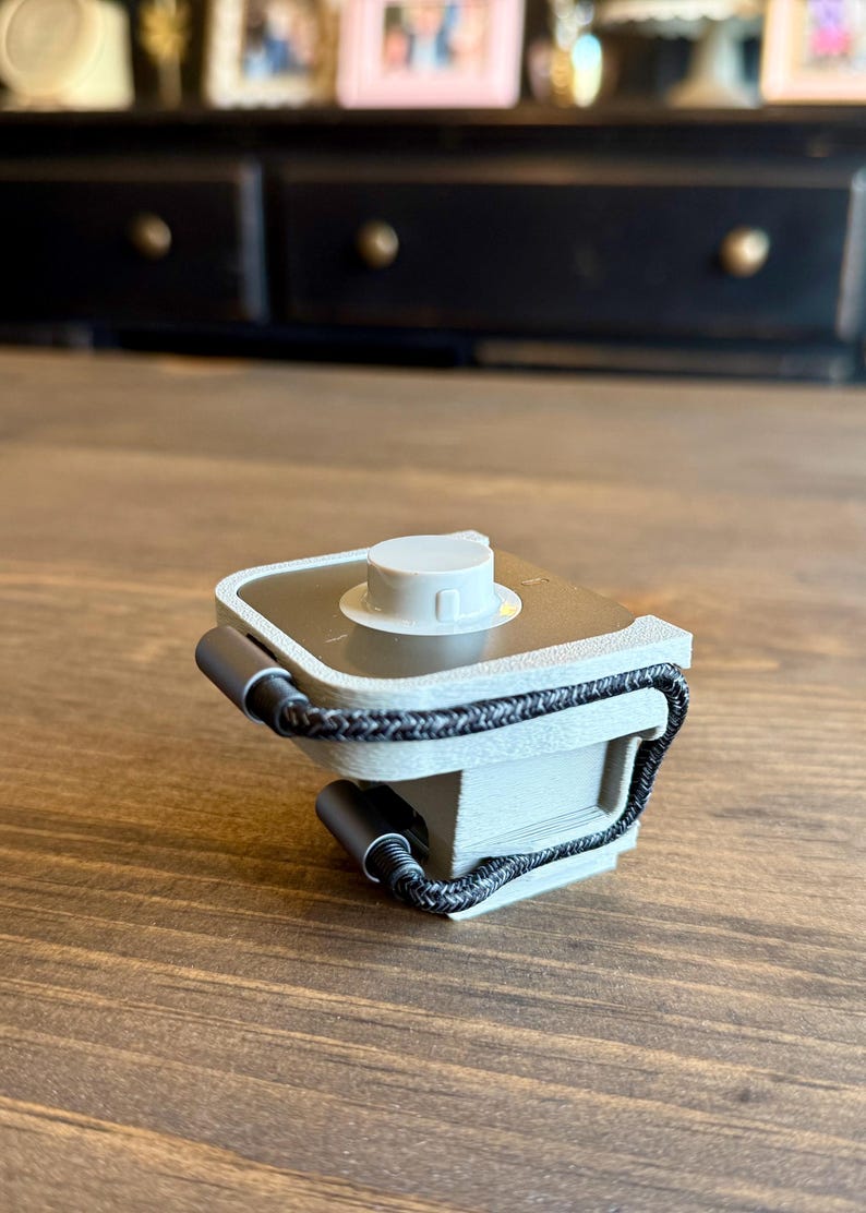 May include: A set of three ceramic mugs with a speckled, matte finish. The mugs are in shades of cream, light gray, and dark gray. Each mug has a simple, minimalist design, perfect for coffee or tea.