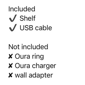 May include: A list of included and not included items. Included: Shelf, USB cable. Not included: Oura ring, Oura charger, wall adapter. Text is in black font on a white background.