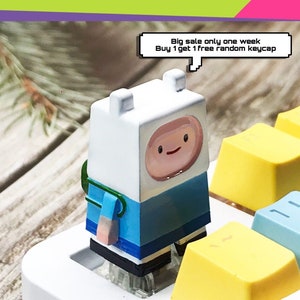 Finn keycap, Adventure Time keycaps, anime keycaps, Jake keycap, handgemaakte keycaps van hars, ambachtelijke custom keycaps, cadeau-ideeën.