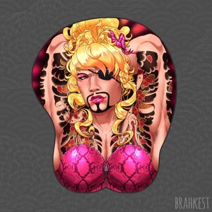 May include: A pink and black patterned bra with a zip fastening. The bra is worn by a person with blonde hair, a black eye patch, and a black beard. The person has a Japanese-style tattoo on their arms and chest.