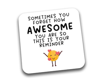 May include: White square coaster with black text that reads "Sometimes you forget how awesome you are so this is your reminder". A yellow cartoon face with pink hearts is below the text.
