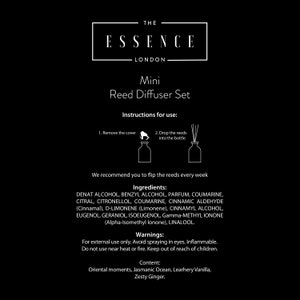 May include: Black background with white text and illustrations for a Mini Reed Diffuser Set. The text includes the brand name, product name, instructions, ingredients, warnings, and content details. The set includes a bottle and reeds.