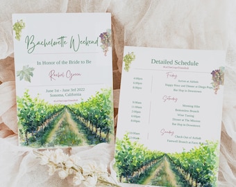 May include: A watercolor illustration of a vineyard with a path leading through the rows of grapevines. The text "Bachelorette Weekend" is at the top of the card, with the text "In Honor of the Bride to Be" below it. The bride's name, "Rachel Green", is written in a cursive font. The date of the event, "June 1st - June 3rd 2022", and the location, "Sonoma, California", are also included. The card also includes a detailed schedule for the weekend, with activities such as a morning hike, wine tasting, and a farewell brunch.
