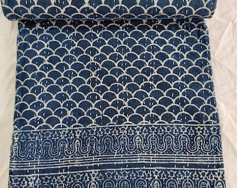 May include: A blue and white kantha quilt with a geometric pattern. The quilt is folded in half and has a white border.