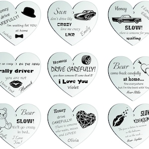 Puede incluir: Nueve llaveros de coche en forma de corazón con diferentes diseños y mensajes. Cada llavero presenta un diseño en blanco y negro con un mensaje personalizado y un nombre. Los mensajes incluyen "Honey drive carefully", "Sun don't drive like crazy", "Bear come back carefully at home", "Slow! Honey", "Rally driver you are not", "Honey drive carefully! I love you", "Slow! There is someone for you waiting", "Bear slow! We'll go crazy in bed", and "The pace is better to increase in the bedroom, not on the road".