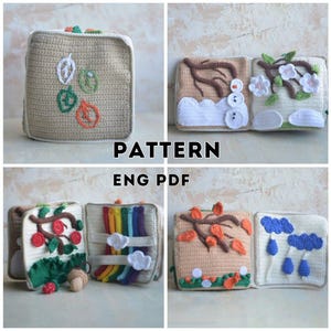 May include: A crocheted, beige quiet book with seasonal themes. The book features embroidered leaves, a snowman, flowers, a rainbow, and autumn leaves. The text "PATTERN ENG PDF" is visible.