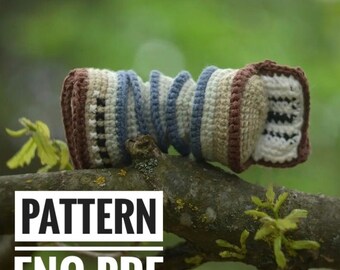 May include: Crochet pattern for a brown, beige, and blue striped amigurumi toy. The pattern is available as a PDF download in English. The text "PATTERN ENG PDF" is printed on the image.