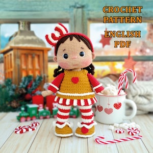 May include: Crochet pattern for a gingerbread girl doll with red and white striped trousers and a brown and white dress. The doll has a red bow in her hair and brown eyes. The pattern is in English and is available as a PDF download.