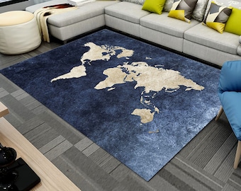 May include: A blue and beige world map rug with a distressed look. The rug is laid out on a wood floor in a living room setting.