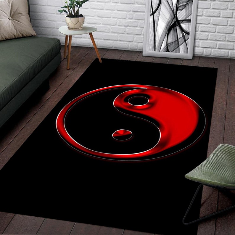 May include: A black and red yin yang symbol rug. The yin yang symbol is in a 3D style with a shiny red finish.