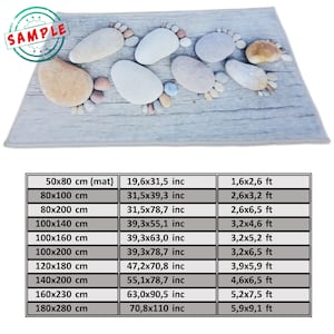 May include: A chart showing different sizes of a stone foot print rug in inches and feet. The rug is made of a soft, comfortable material and is perfect for adding a touch of nature to your home.