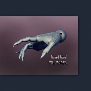May include: A 3D-rendered, light gray lizard hand with long, pointed fingers and textured skin. The hand is positioned against a dark purple background. Text on the image reads "lizard hand STL MODEL".