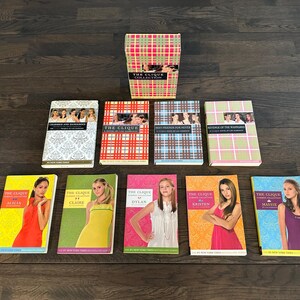 May include: A set of ten paperback books with colourful covers featuring the title "The Clique" and the names of different characters. The books are arranged in two rows, with the top row containing the title "The Clique Collection".