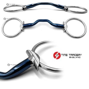 May include: A blue and silver horse bit with a curved mouthpiece and two large circular rings. The bit is made of metal and has a shiny finish. The brand name "TIME TRADER ENGLAND" is visible in the image.