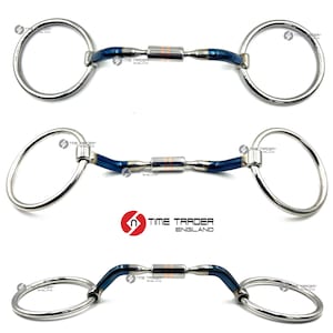 May include: Three horse bits with stainless steel rings and blue and silver accents. The center section has a copper-coloured band. The bits are arranged vertically against a white background. The logo "TIME TRADER ENGLAND" is visible.