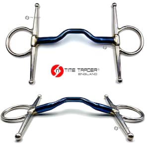 May include: A blue and silver horse bit with a curved mouthpiece and two rings. The bit is labelled "TIME TRADER® ENGLAND".