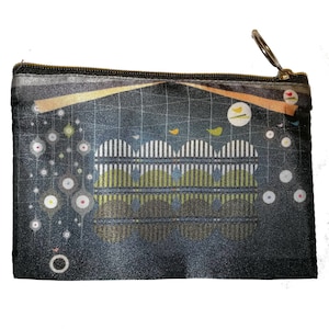 May include: A black zippered pouch with a colourful abstract design featuring geometric shapes, lines, and birds. The design includes circles, stripes, and a repeating pattern of small circles.