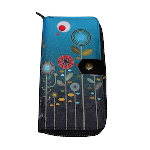 May include: A blue and black zippered wallet with a colourful floral design. The wallet has a flap with a black button.