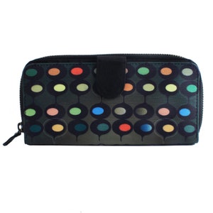 May include: A black zippered wallet with a colourful geometric pattern of circles and ovals. The wallet has a flap closure with a black leather tab.