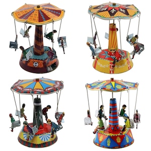 May include: Four vintage tin toy carousels with colorful painted details and figures. Each carousel has a different design and color scheme. The carousels are in good condition and would make a great addition to any vintage toy collection.