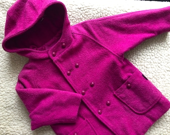 May include: A bright pink hooded coat with a double breasted closure and two pockets. The coat is made of a soft, fuzzy material.