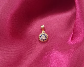 22k solid gold pendant with cubic zirconia stone. White and blue colour stones.