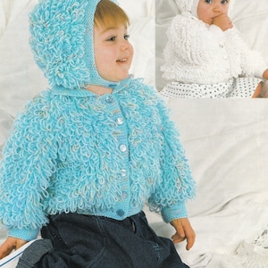 May include: A blue knitted baby cardigan with a matching hat. The cardigan has a button fastening and the hat has a fluffy pom-pom on top.