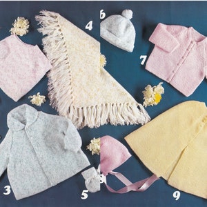 May include: A set of nine knitted baby items in pink, blue, and yellow. The items include a hat, a cardigan, a vest, a shawl, a cape, and mittens.