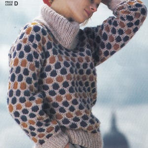 May include: A beige sweater with a brown, blue, and beige honeycomb pattern. The sweater has a high turtleneck and long sleeves. The sweater is 34 to 41 inches in size.