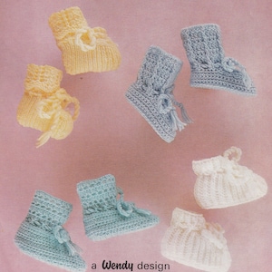 May include: Six pairs of crocheted baby booties in various colours, including yellow, blue, and white. The booties are all made with a simple stitch pattern and have a tie at the top. The text "a Wendy design in D.K. & 4 ply" is printed at the bottom of the image.