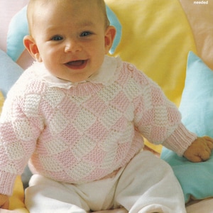 May include: A baby in a pink and white chequered knitted sweater with a white collar and trousers. The baby is smiling. The text "Some experience needed" is in the upper right corner.