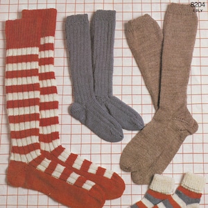 May include: A knitting pattern for ribbed and plain socks. The pattern includes instructions for knitting on two needles and uses 4-ply yarn. The pattern is for sizes 2 to 3. The image shows four pairs of socks in different colors and patterns.