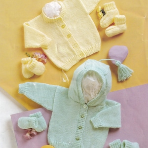 May include: Two baby sweaters, one yellow and one mint green, with matching booties and mittens. The yellow sweater is a button-down cardigan. The mint green sweater has a hood. The items are displayed on a yellow and purple background.