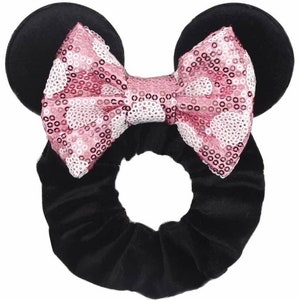 May include: Black velvet hair scrunchie with pink sequin bow and mouse ears.