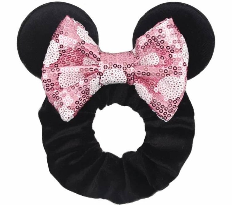 May include: Black velvet hair scrunchie with pink sequin bow and mouse ears.