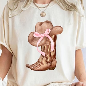 Coquette Cowgirl PNG, Western sublimation design, Soft girl era, Cowgirl boots png, Boots with bows, coquette shirt design, pink bow png