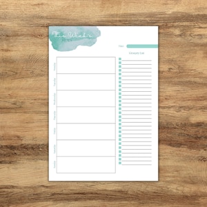 May include: A printable weekly meal planner with a teal watercolor background. The planner includes a section for each day of the week and a grocery list.