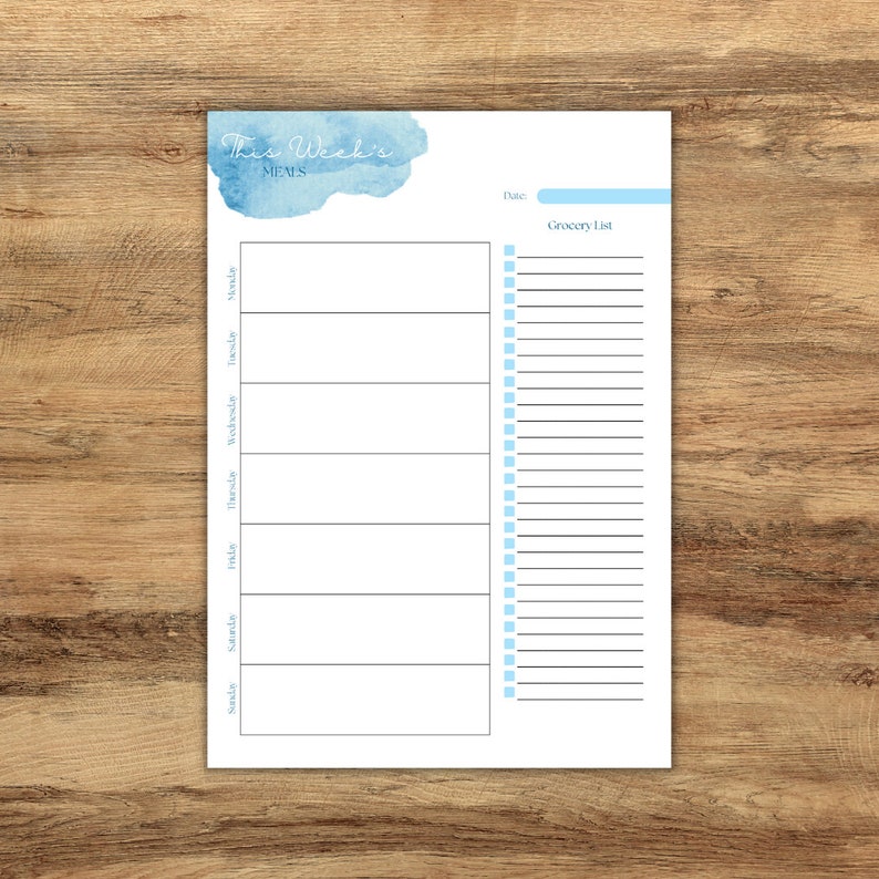 May include: Printable weekly meal planner with a blue watercolor background. The planner includes a section for each day of the week and a grocery list.