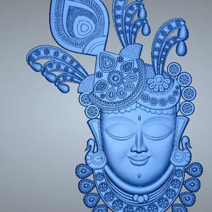 May include: A light blue, 3D-rendered sculpture of a serene face, adorned with intricate details. The headpiece features a large peacock feather and ornate floral and teardrop designs. The sculpture has a necklace with teardrop pendants.