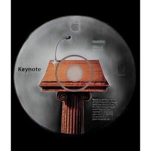 May include: A CD with a graphic of a wooden podium with a microphone, and the word "Keynote" on the left. The Apple logo is at the top. The background is a gradient of gray and black.